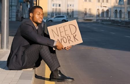 Young Ugandan graduate looking for jobs online in 2025